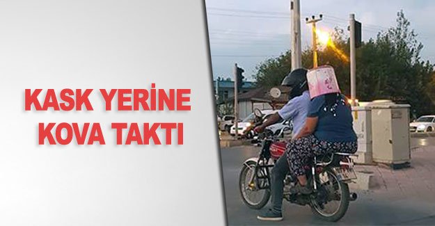 Kask yerine kova taktı